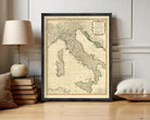 The image is a framed map of Italy, showing the country's geographical layout and surrounding areas.