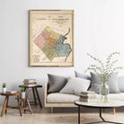 a vintage map of a city, with a cozy living room setting in the background.