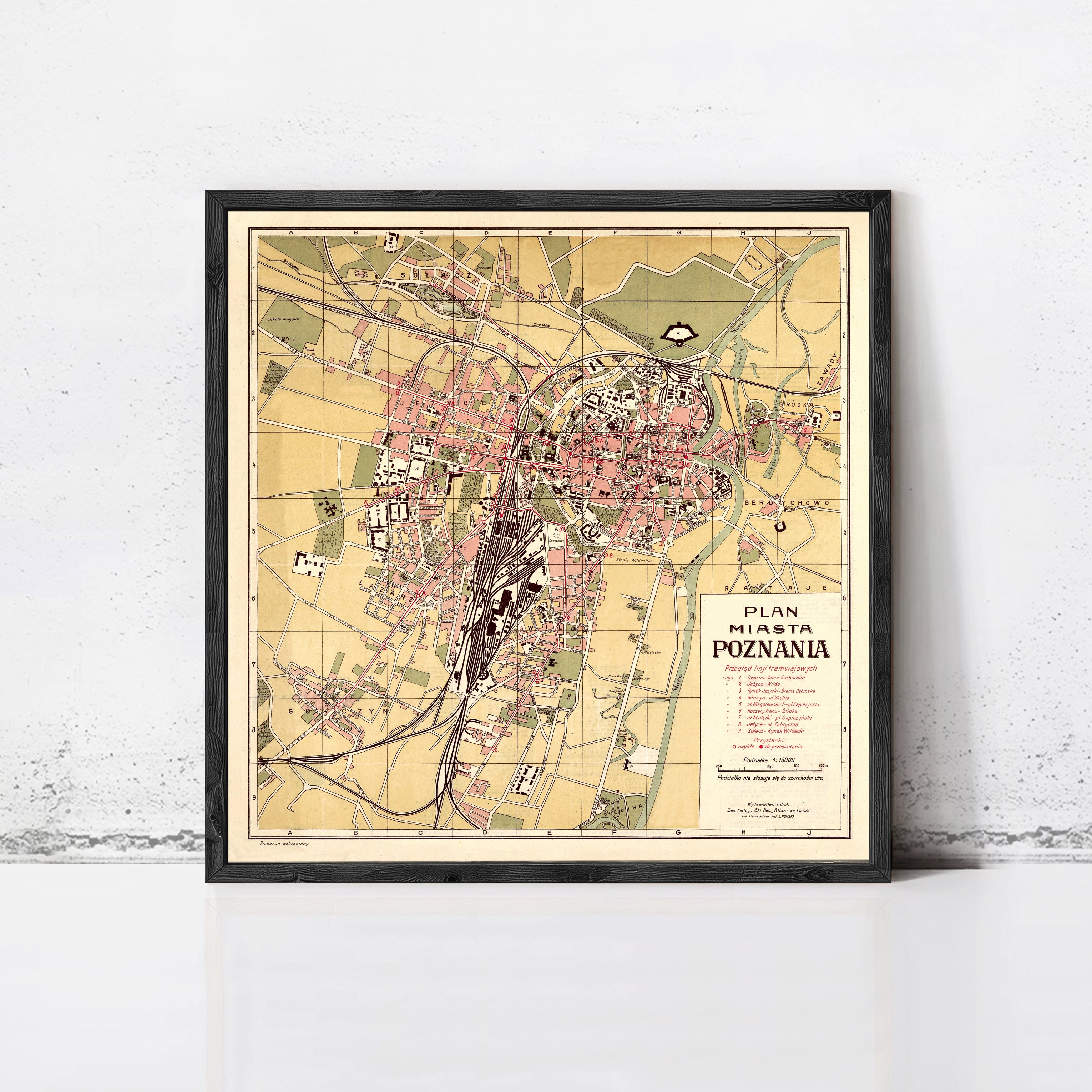 The image is a framed map of the city of Poznan, Poland, depicting the layout and various landmarks within the city.