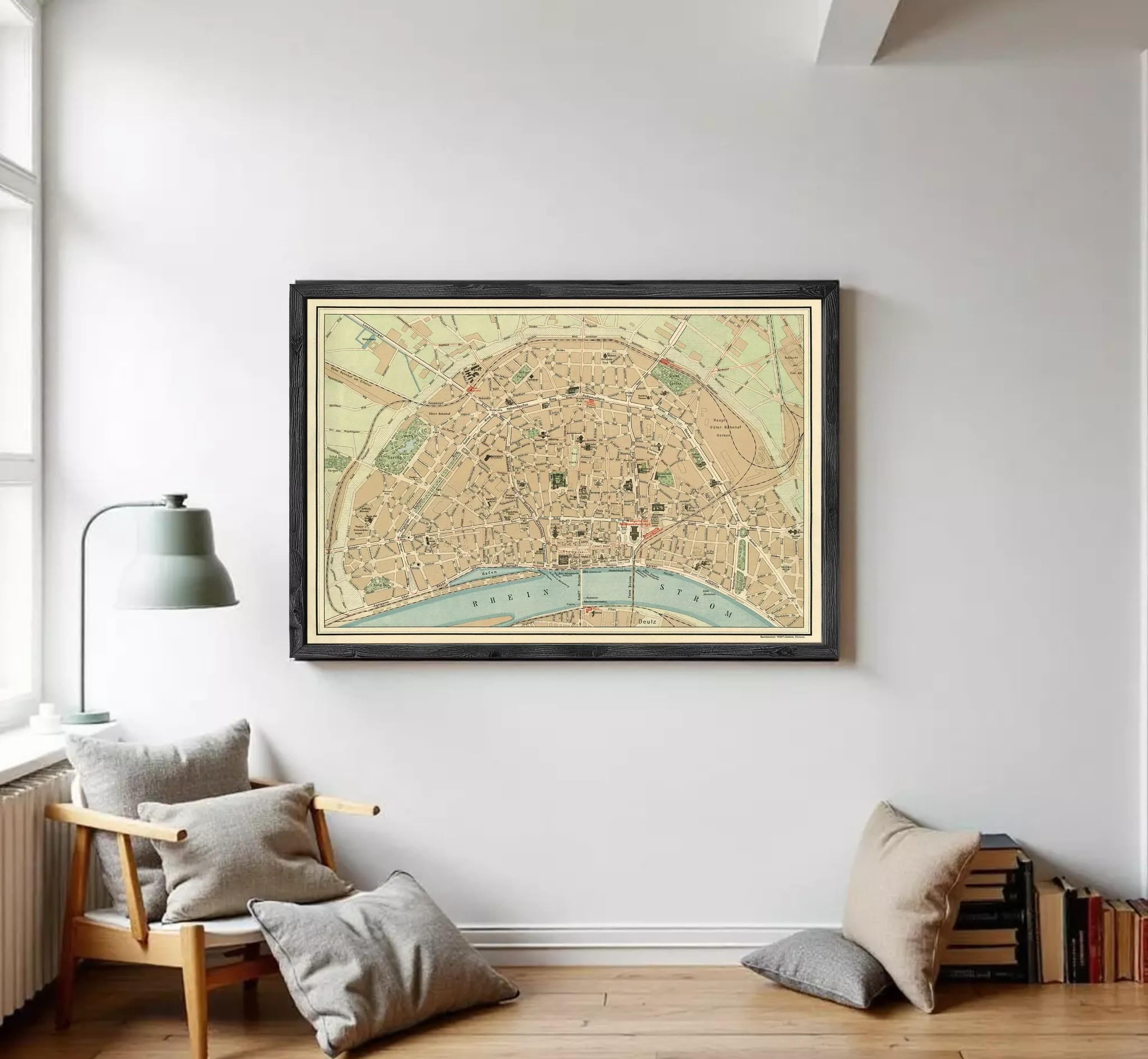 The image is a framed vintage map of a city, depicting streets, landmarks, and other geographical features.