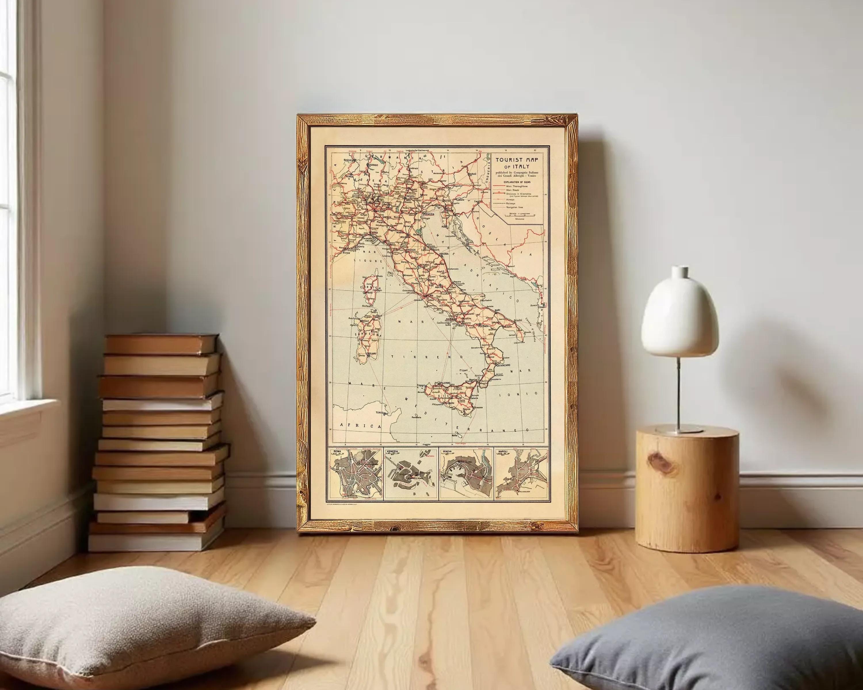 The image is a framed vintage map of Italy, showing the country's geographical layout and surrounding areas.