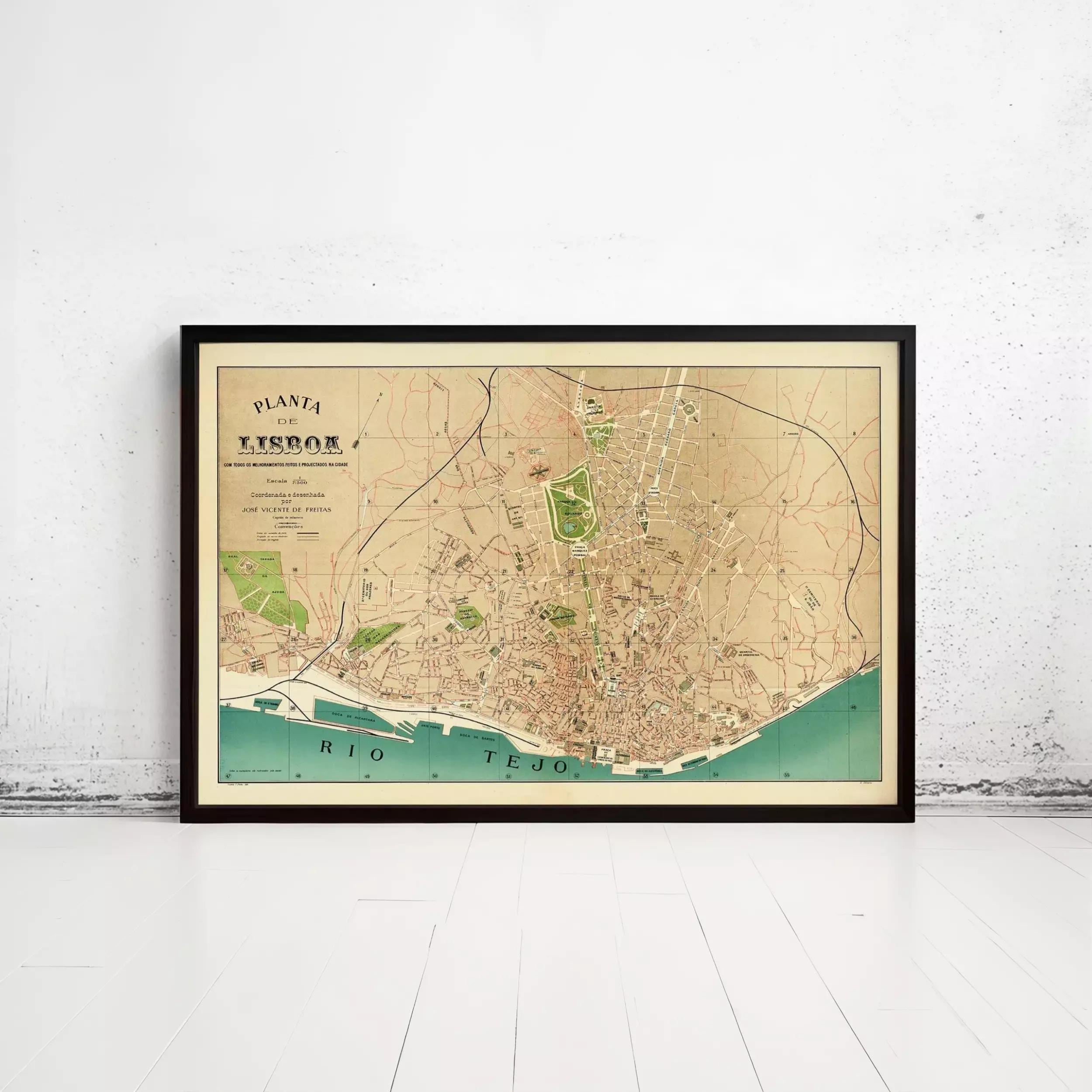 The image is a framed vintage map of Lisbon, Portugal, depicting the city's streets and surrounding areas.