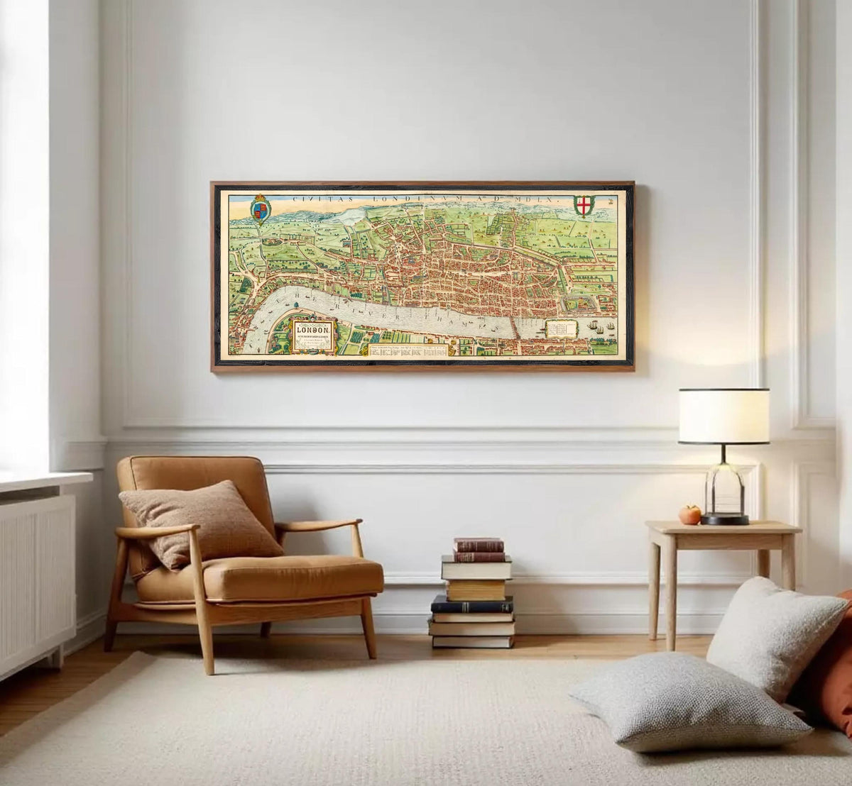 a living room with a large framed map of London hanging on the wall above a brown armchair. There are also a few books and a lamp on a side table in the room.