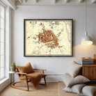 The image is a framed map of a city, likely a historical or vintage map, displayed on a wall.