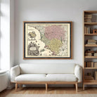 The image is a framed antique map of Europe, featuring detailed illustrations and color-coded regions.