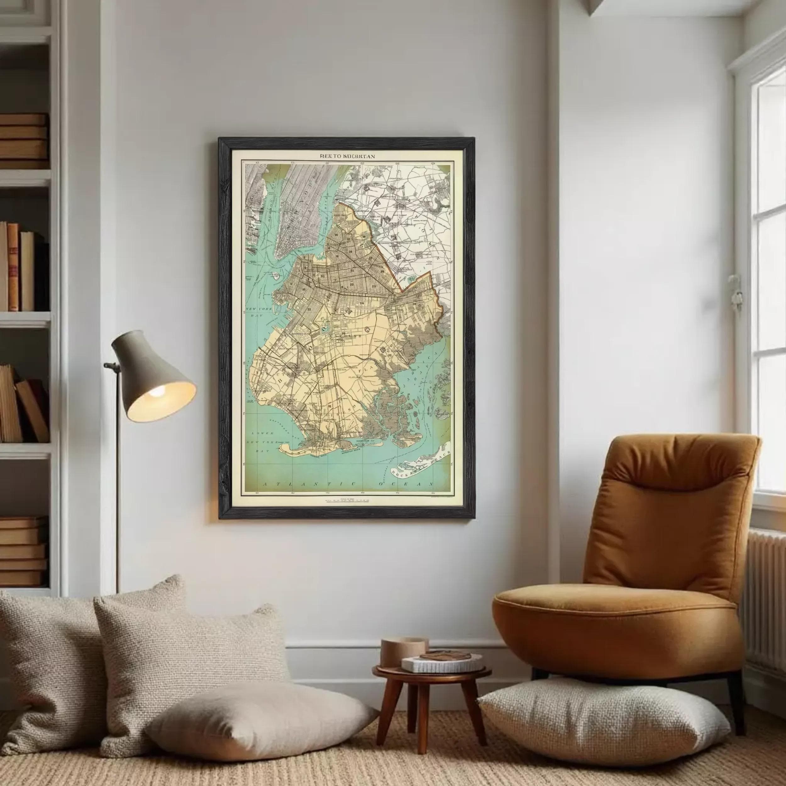 The image is a framed vintage map of New York City, depicting the city's streets, neighborhoods, and surrounding areas.