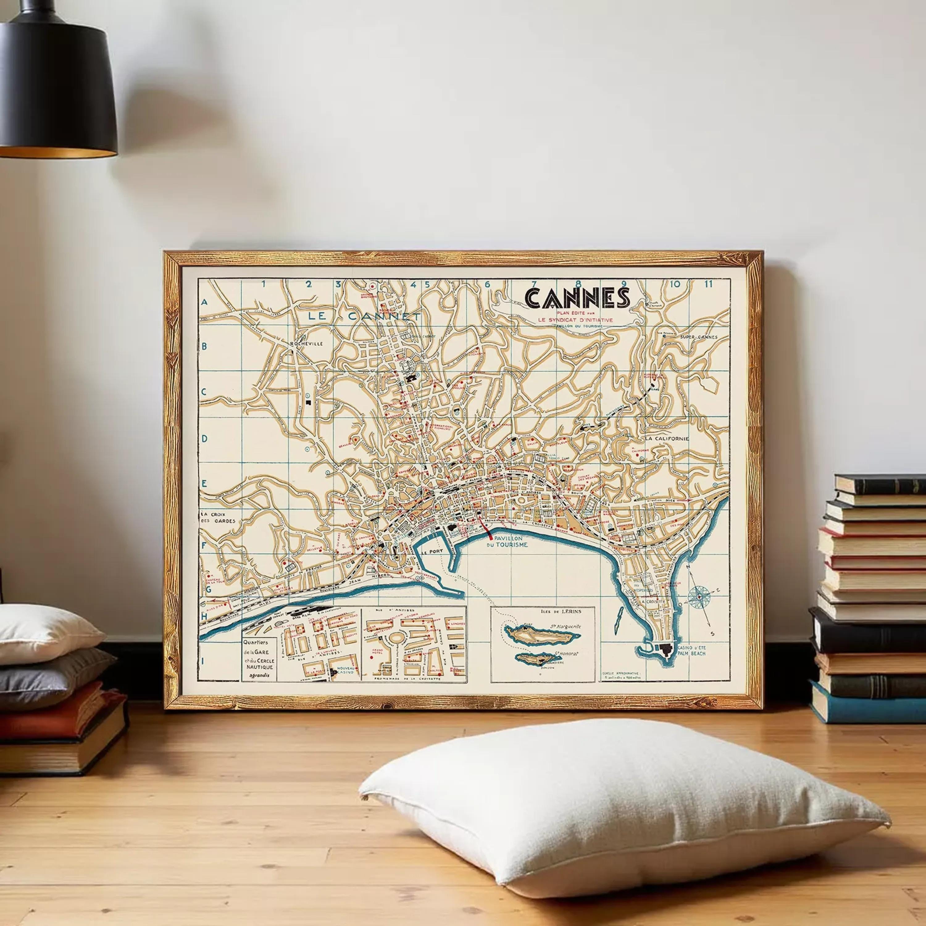 a large framed map of the city of Cannes, France, displayed on a wall.