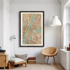 The image is a framed vintage map of New York City, depicting the city's streets, waterways, and surrounding areas.