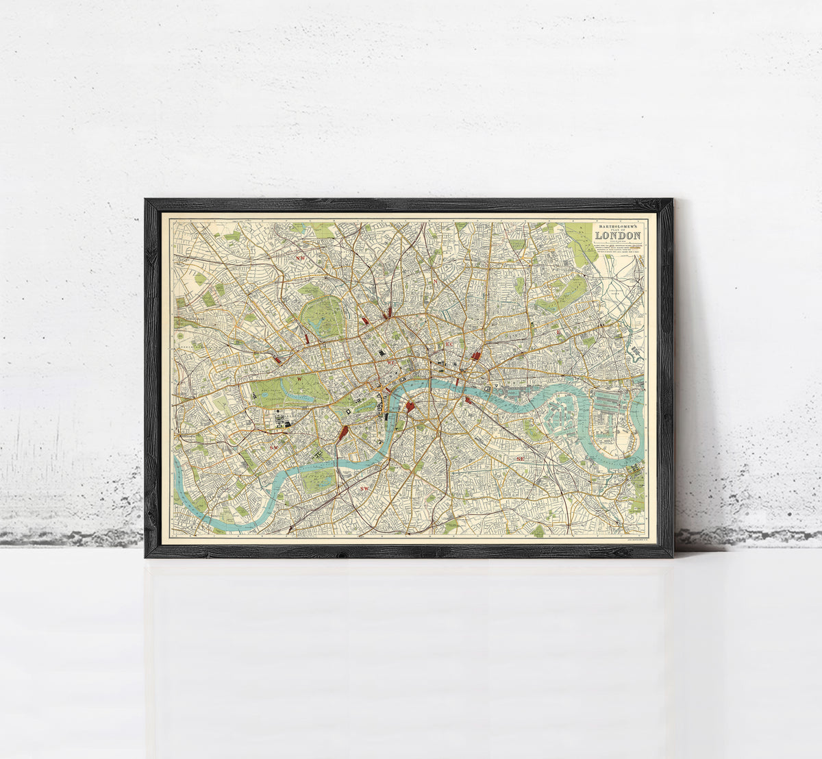 The image is a framed vintage map of London, depicting the city's streets, landmarks, and rivers.