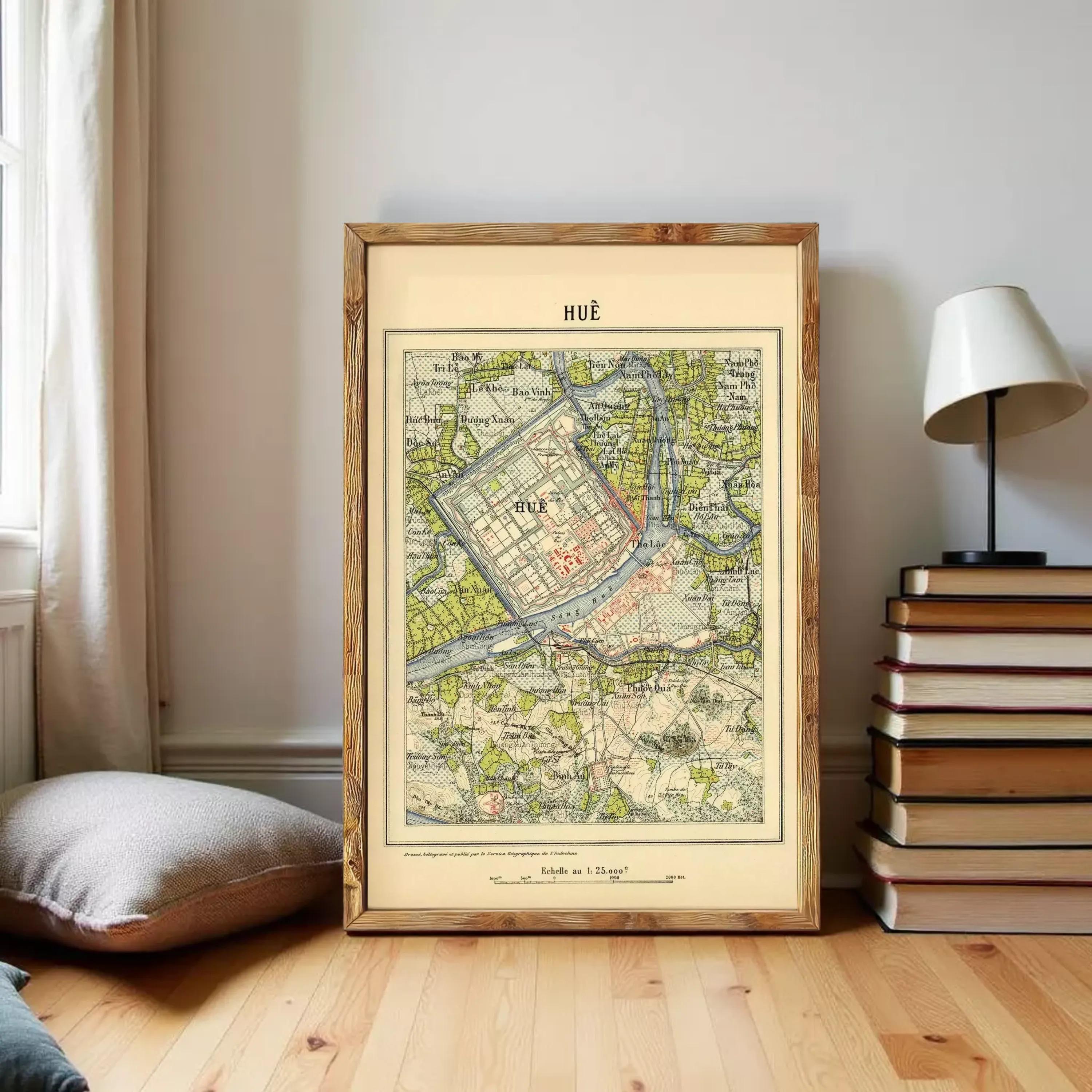 The image is a framed vintage map of Hue, Vietnam, with a wooden frame.