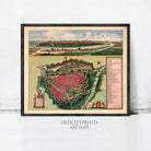 The image is a framed vintage map of a city, depicting a detailed layout of the city's streets, buildings, and surrounding landscape.