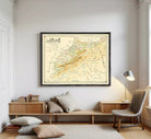 The image is a framed vintage map of a region, likely depicting a mountainous area, with various roads and landmarks marked on it.