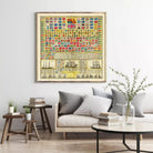 a large framed poster of various flags and nautical symbols hanging on a wall above a couch and a coffee table in a living room setting.