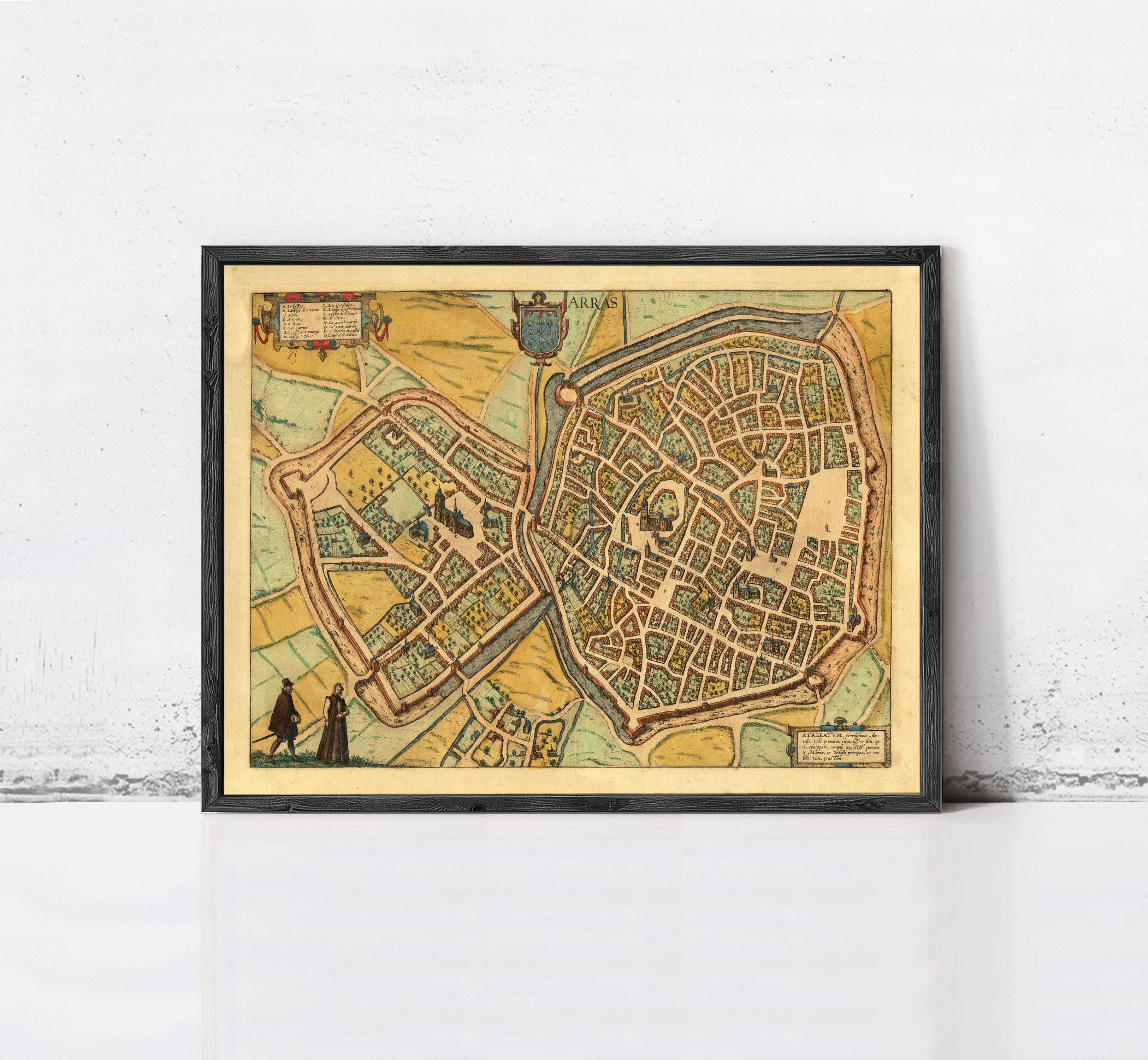 The image is a framed vintage map of a city, depicting a detailed layout of streets, buildings, and other urban features.