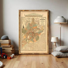 a large framed map of the city of Washington, D.C., with a lamp and some books in the background.