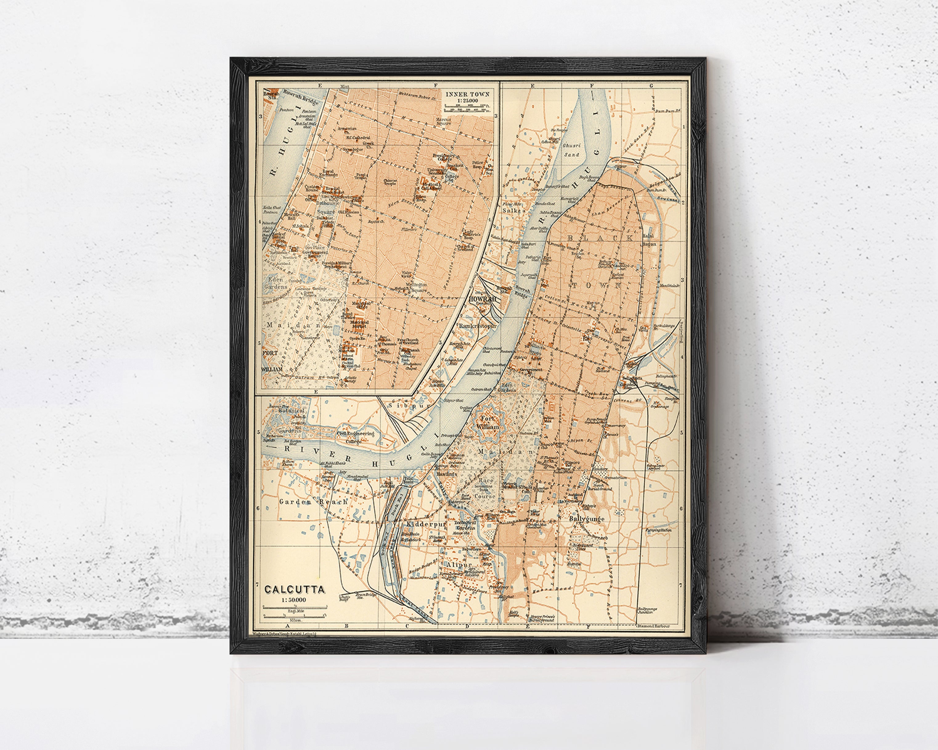 The image is a framed vintage map of Calcutta, India, depicting various landmarks and geographical features.