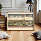 The image is a framed vintage map of Prague, Czech Republic, depicting the city's skyline and surrounding landscape.