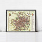 The image is a framed map of Milan, Italy, depicting the city's streets and landmarks.