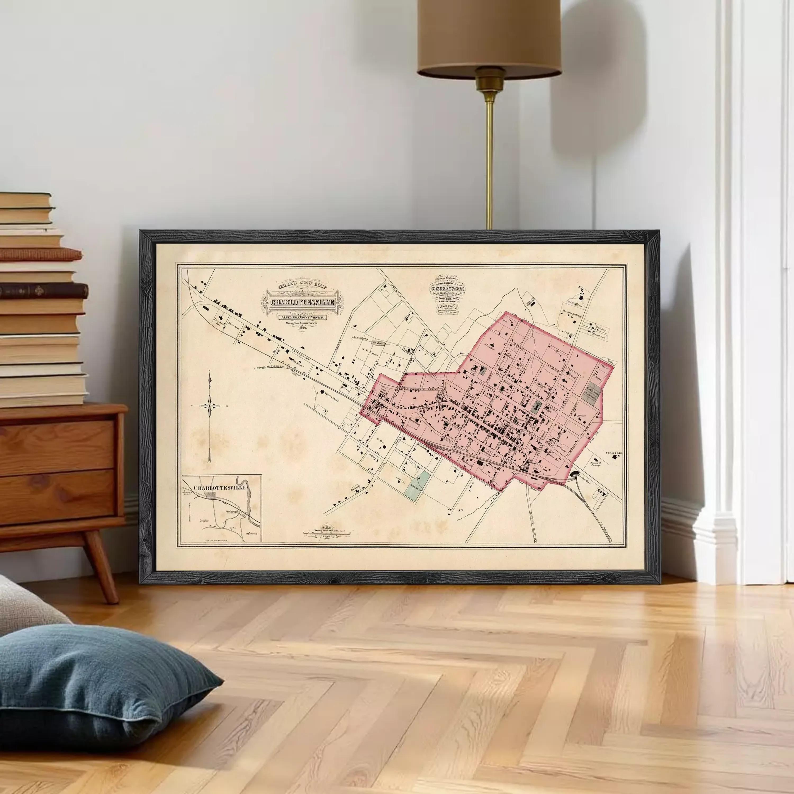 The image is a framed vintage map of a city, depicting a detailed layout of streets, buildings, and other urban features.