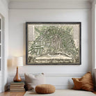 The image is a framed antique map of Amsterdam, Netherlands, depicting the city's layout and surrounding areas.