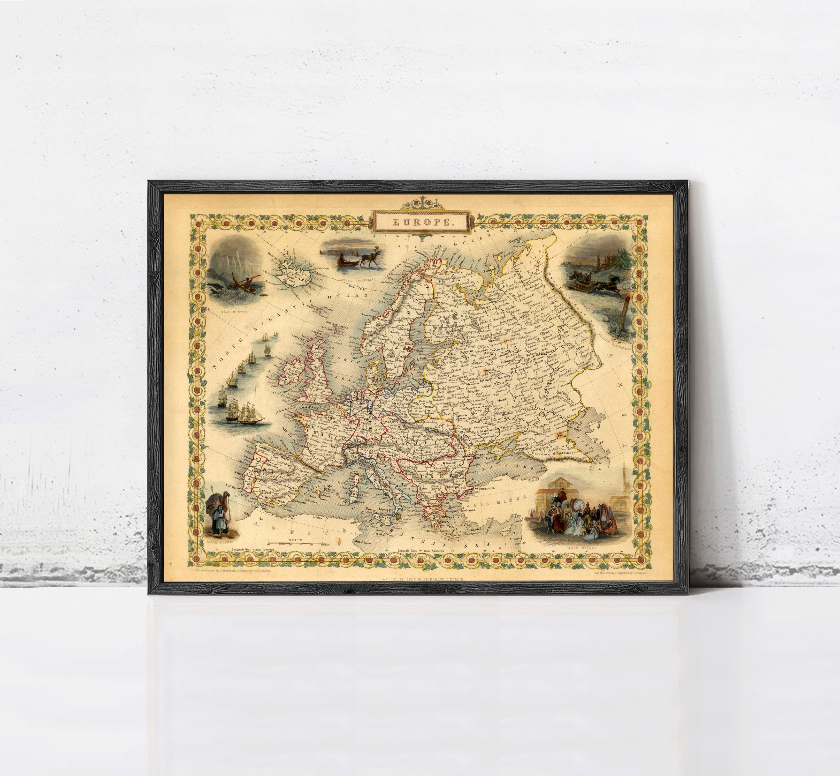 The image is a framed vintage map of Europe, featuring various illustrations and labels.