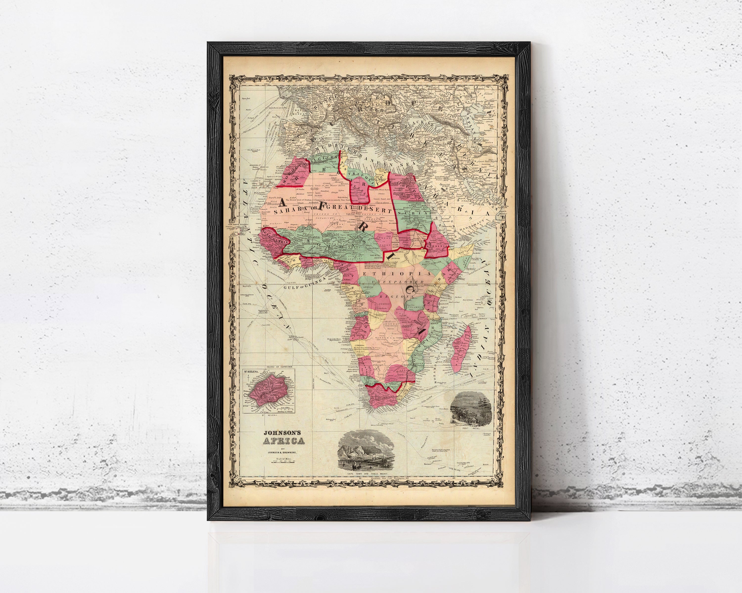 The image is a framed vintage map of Africa, depicting the continent in a detailed and colorful manner.