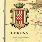 The image is a map of Gerona, Spain, with a coat of arms prominently displayed in the center. The coat of arms is a shield with a crown at the top and a wavy pattern in red and white. The map includes various locations and landmarks, such as the city of Cádiz, the city of Palma, and the city of Batalha. The text on the map provides information about the city of Gerona, including its capital city, Cádiz, and its location within the country.