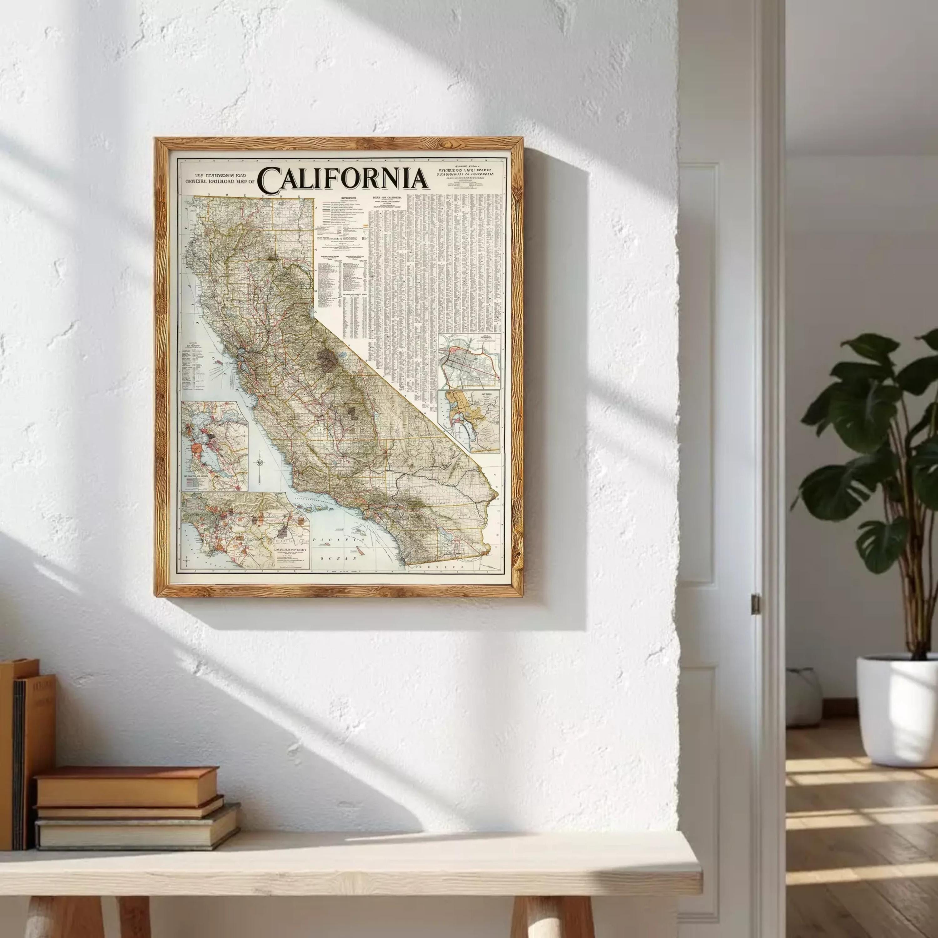 a framed map of California hanging on a white wall.
