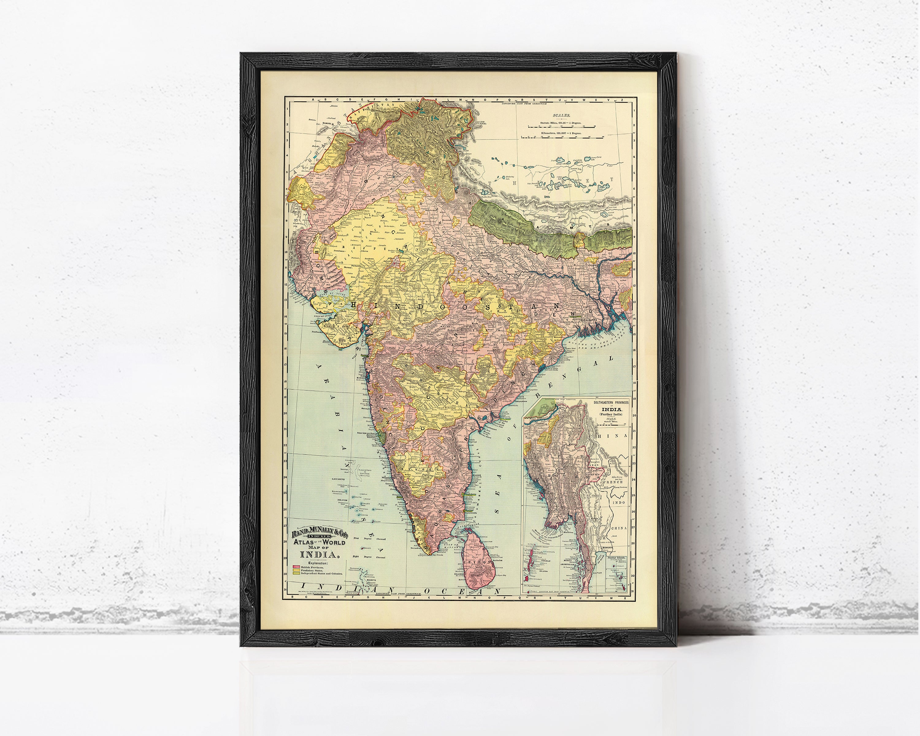 The image is a framed vintage map of India, depicting the country in a detailed and colorful manner.