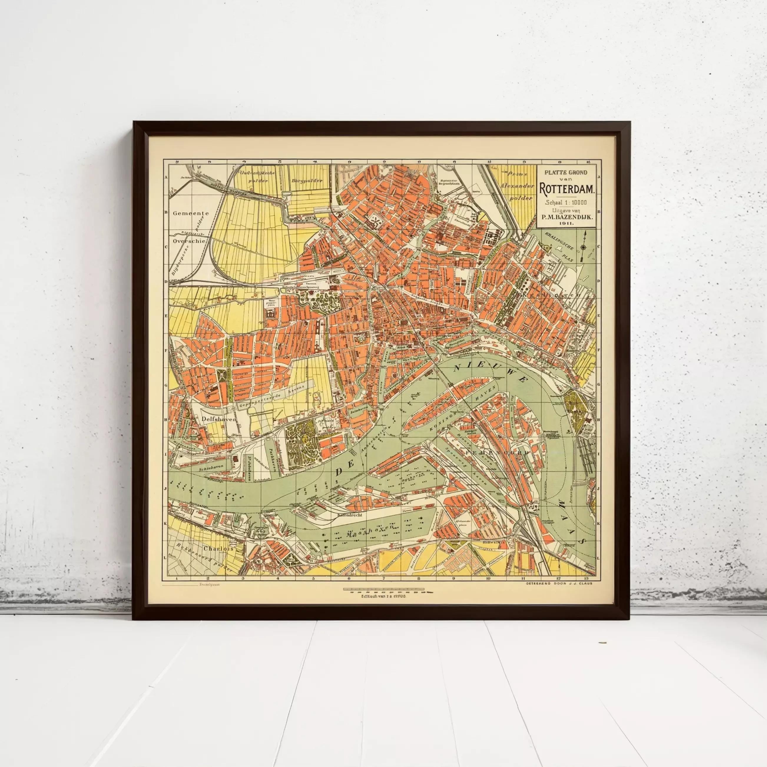 The image is a framed vintage map of the city of Rotterdam, Netherlands, depicting the city's layout and surrounding areas.