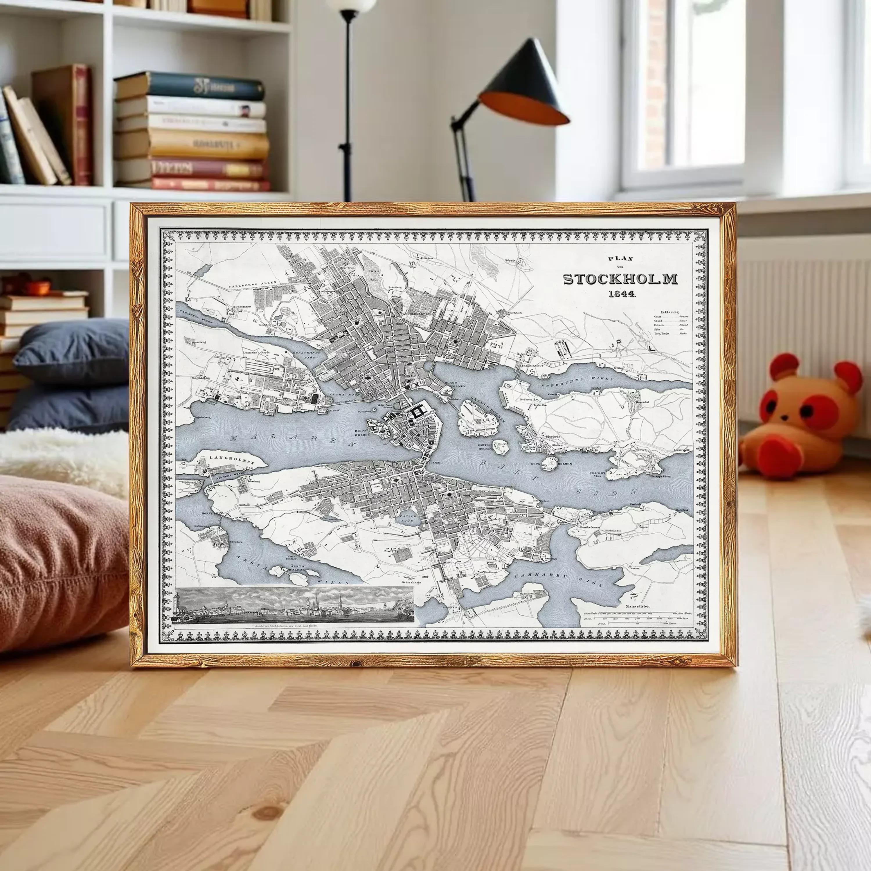 a framed map of Stockholm, Sweden, with a wooden floor and a stuffed animal in the background.