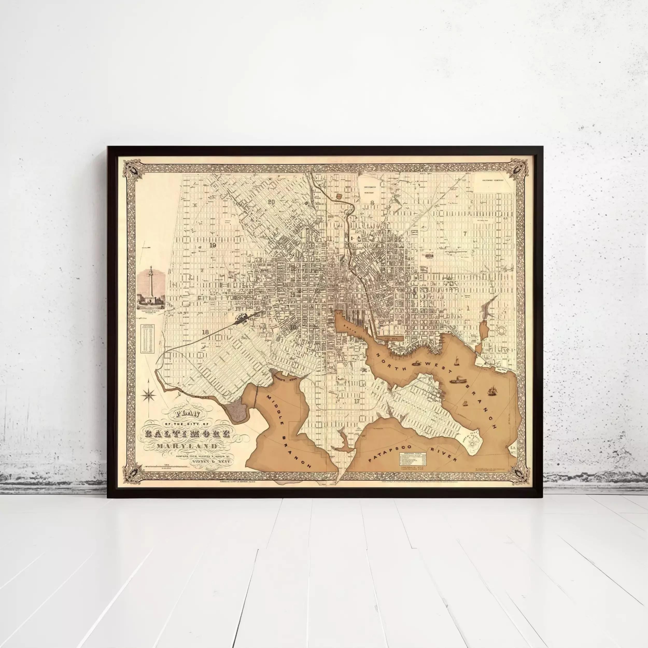 The image is a framed antique map of Baltimore, Maryland, depicting the city's streets and surrounding areas.