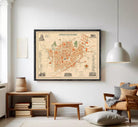 The image is a framed vintage map of a city, depicting various landmarks and streets.