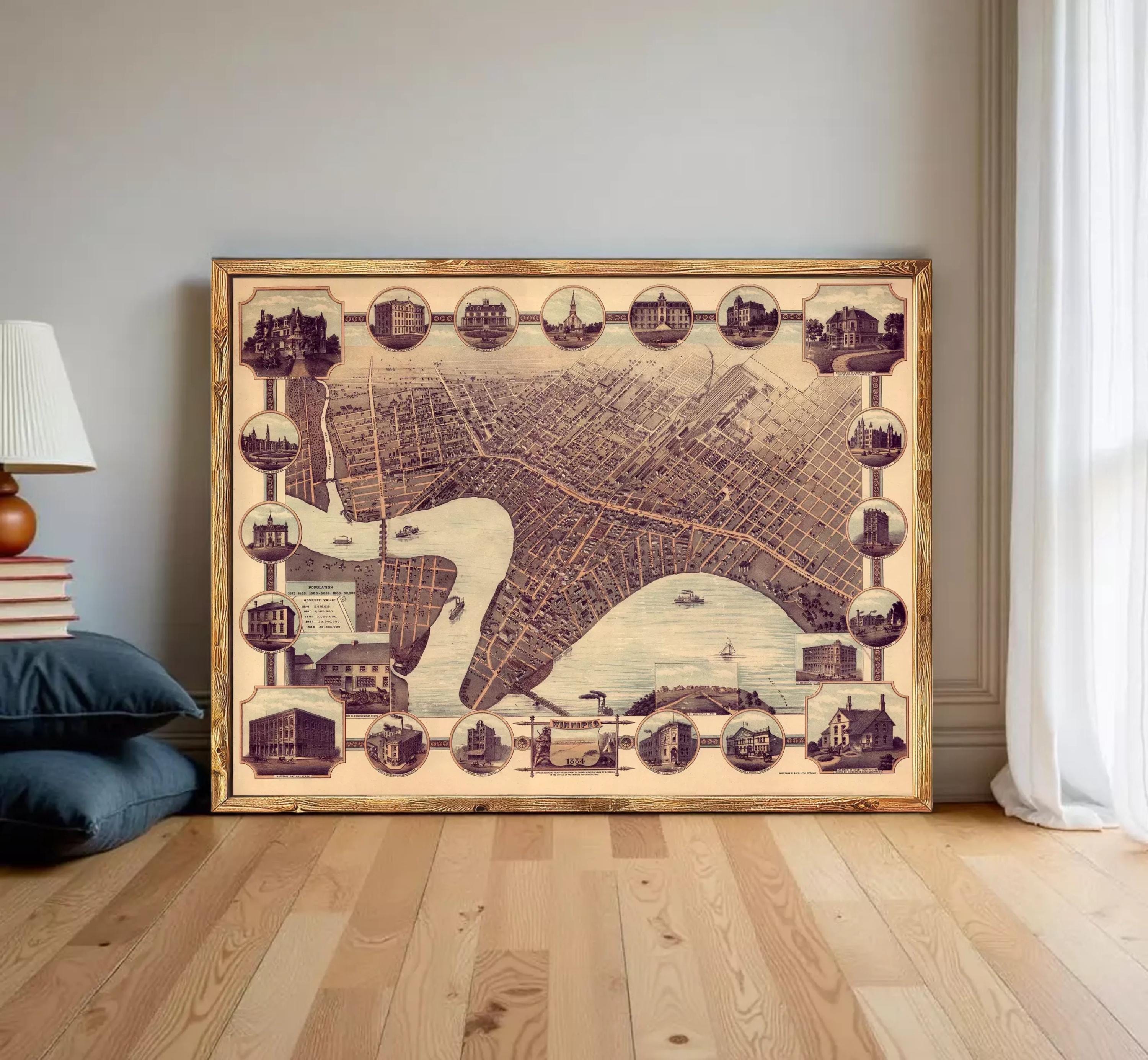 The image is a framed vintage map of a city, featuring various landmarks and buildings depicted in a collage-like arrangement.