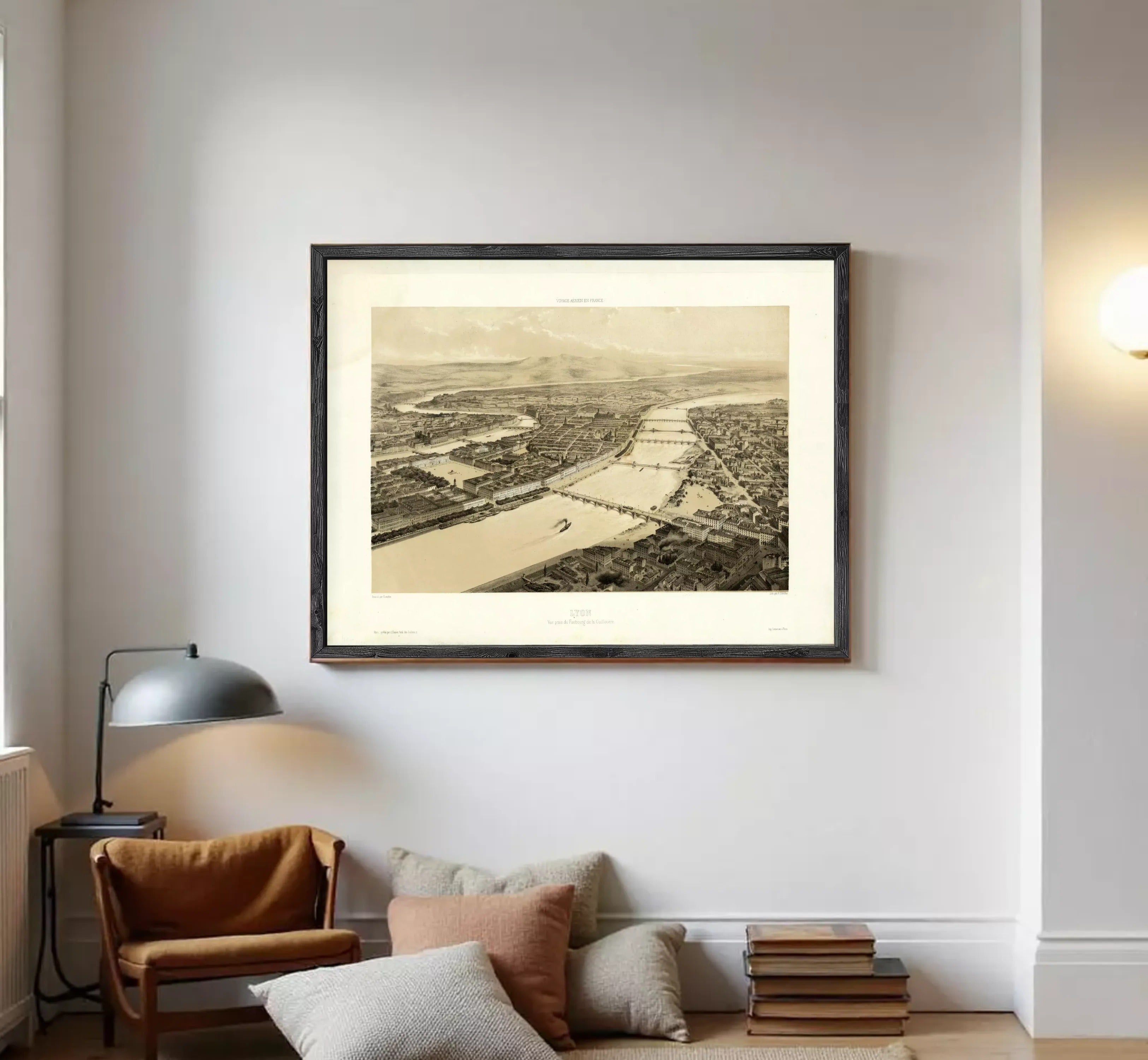 The image is a framed black and white aerial photograph of a cityscape, depicting a river or canal running through the center of the city.