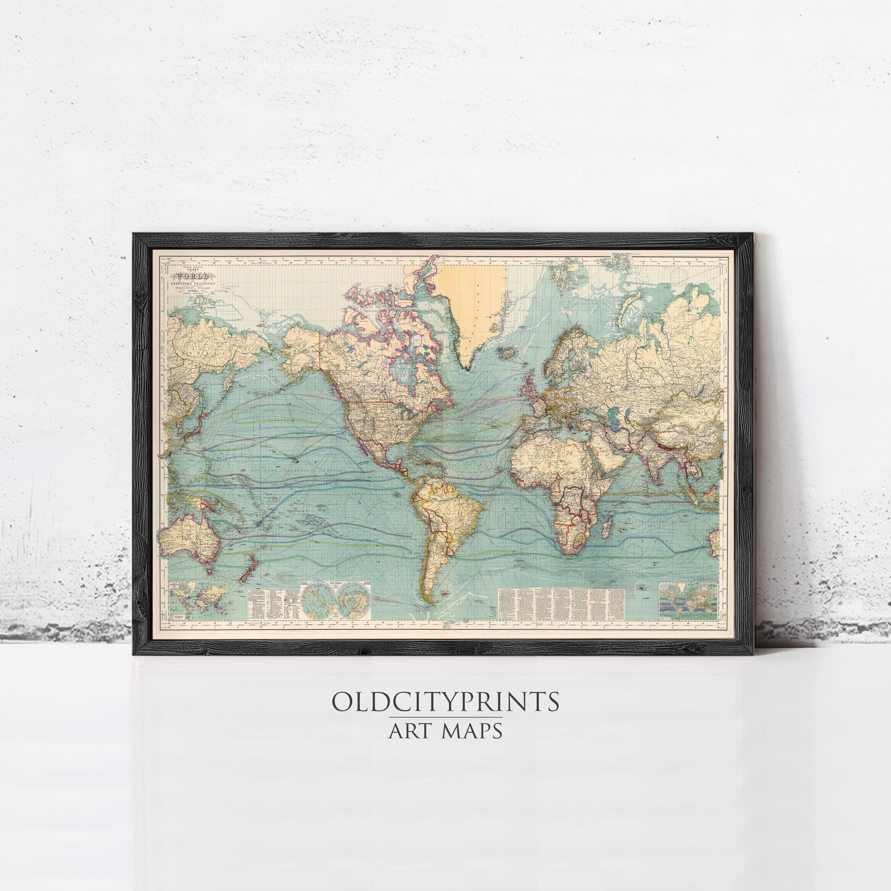 A framed vintage world map with a black border and a light blue background, displayed on a white wall.