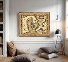 The image is a framed antique map of Europe, featuring detailed illustrations and labels.