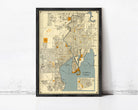 The image is a framed vintage map of Tampa, Florida, depicting the city's streets, landmarks, and surrounding areas.