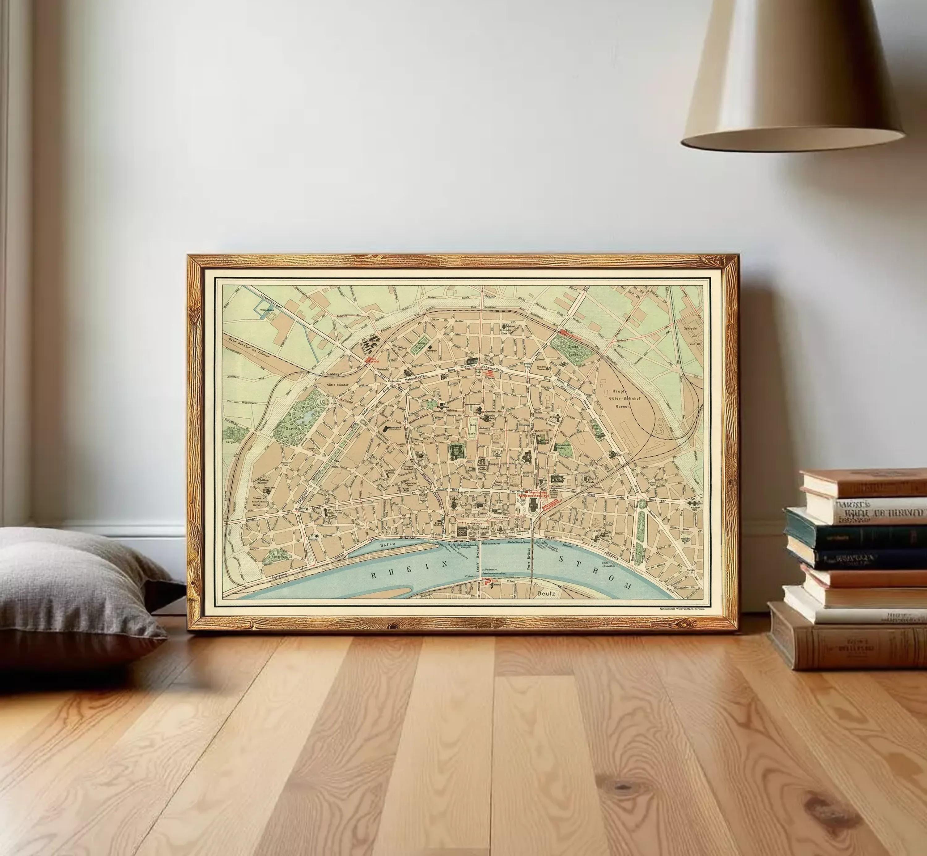 The image is a framed vintage map of a city, likely Paris, with various streets and landmarks depicted.