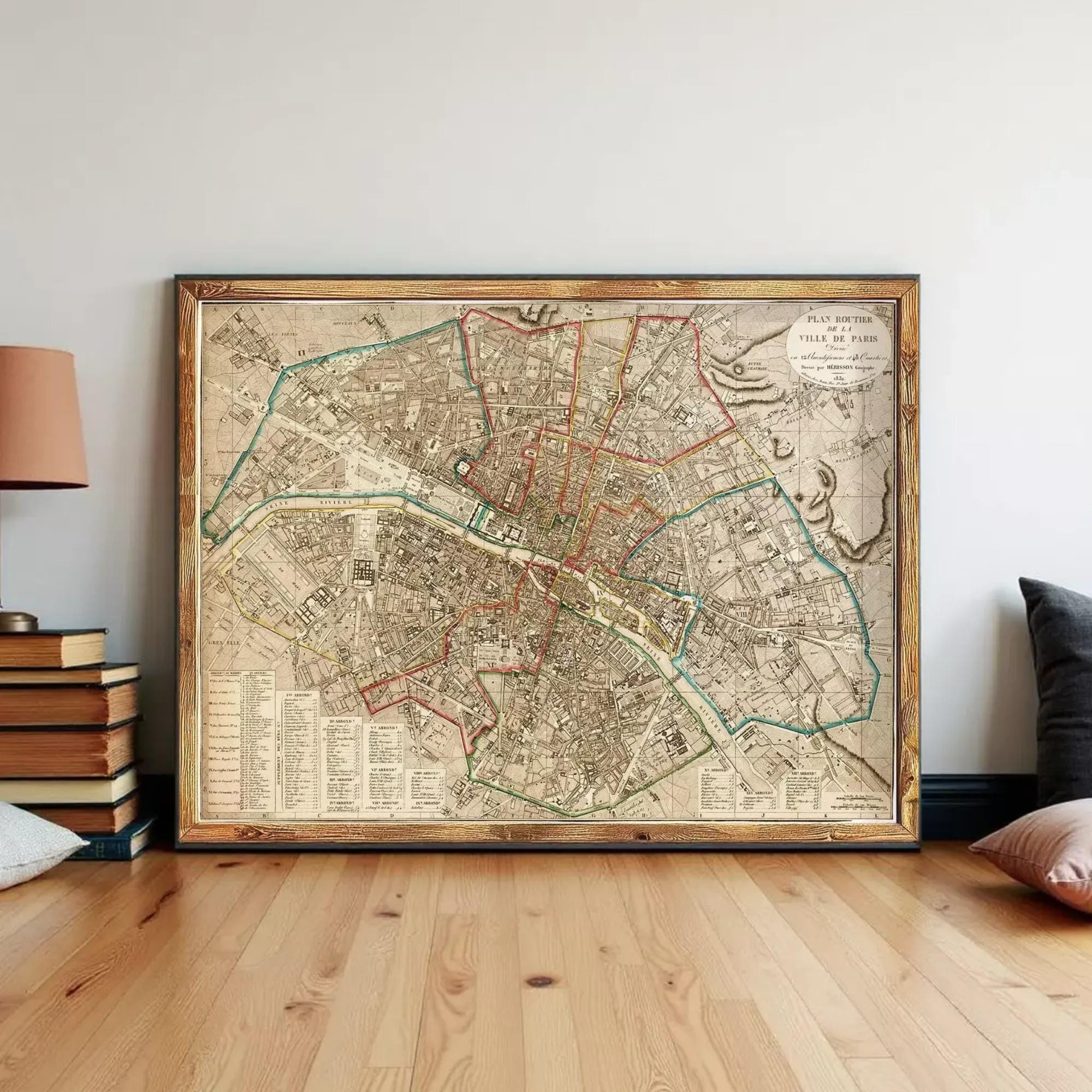 a large, framed map of Paris, France, displayed on a wall.