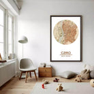 a cozy living room with a large framed map of Cairo hanging on the wall, a comfortable chair, a small table with books, and a teddy bear on the floor.