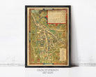 The image is a framed antique map of a town or city, with detailed illustrations and labels.