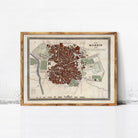 The image is a framed map of Madrid, Spain, depicting the city's layout and surrounding areas.