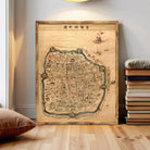 The image is a framed map of a city, likely from an ancient or historical period, with various landmarks and streets depicted.