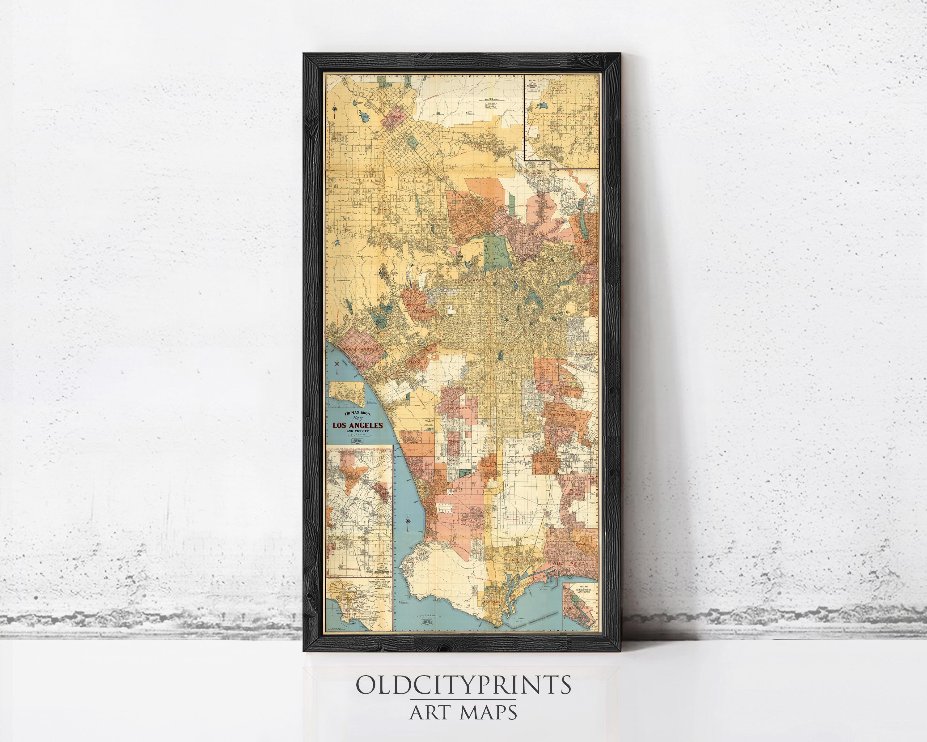 The image is a framed vintage map of Los Angeles, California, with a black border and a white background.
