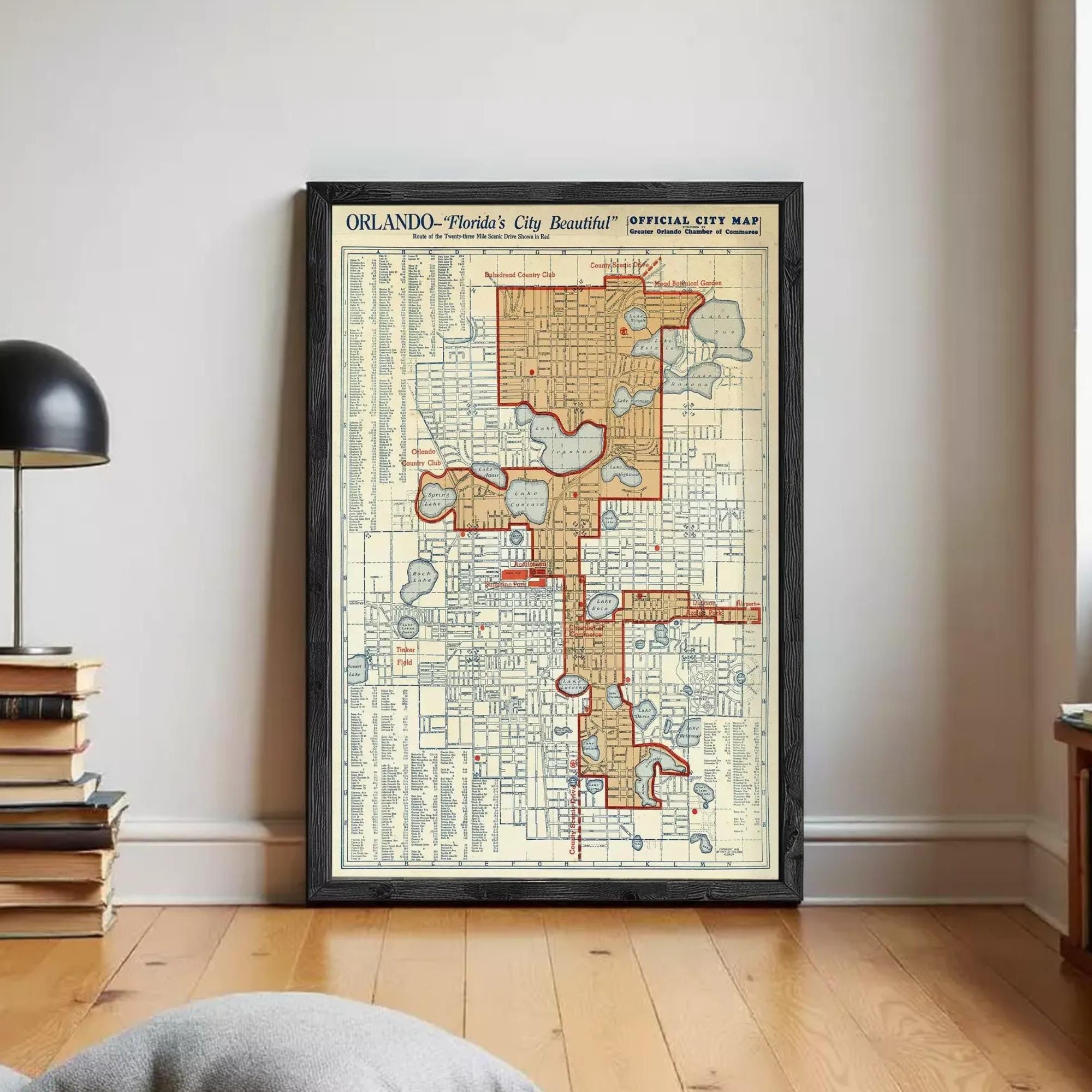 The image is a framed vintage map of Orlando, Florida, depicting the city's layout and streets.