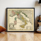 The image is a framed vintage map of Italy, showing the country's geographical layout and surrounding regions.