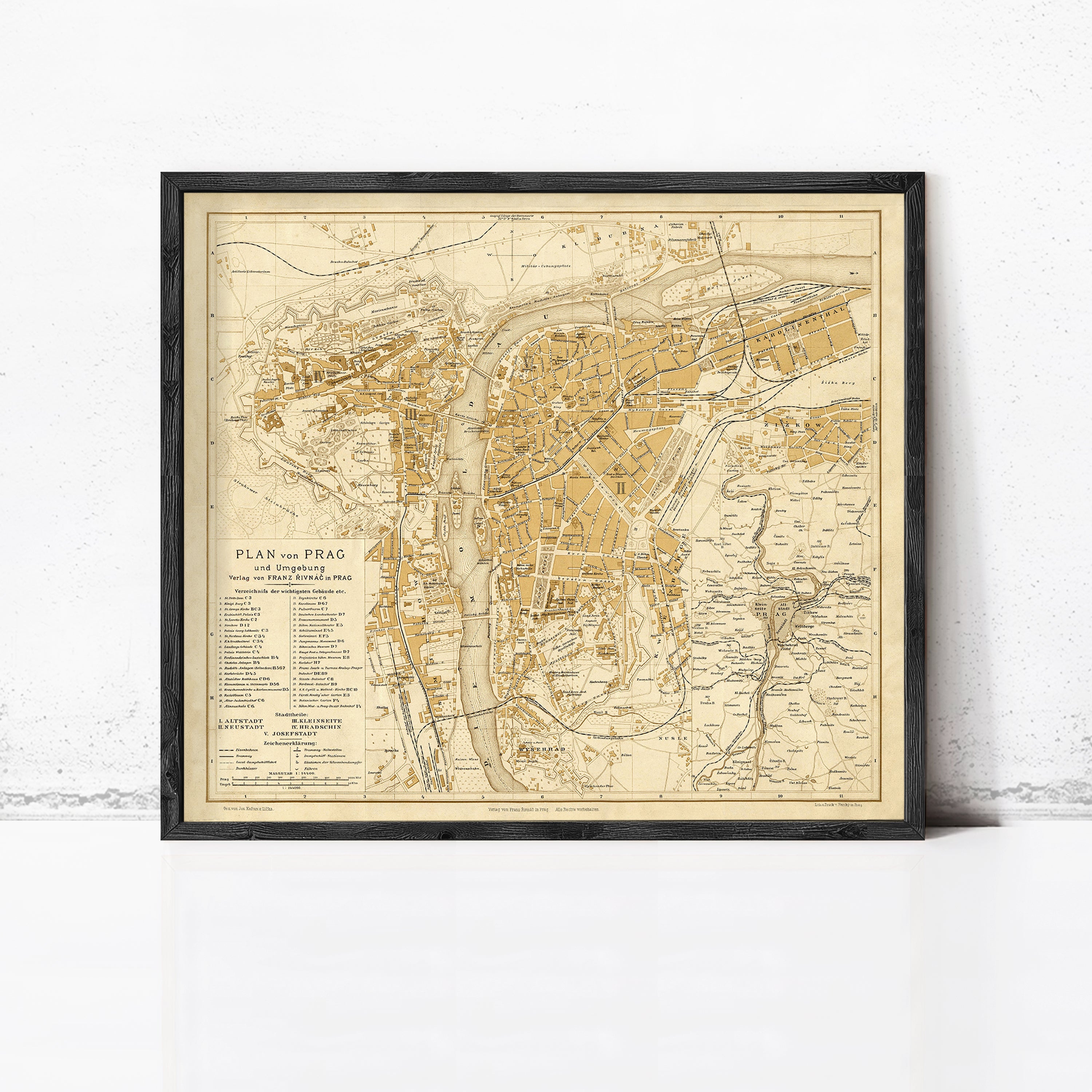 The image is a framed vintage map of Prague, Czech Republic, depicting the city's layout and surrounding areas.