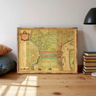 The image is a framed antique map of the city of Philadelphia, Pennsylvania, with a detailed and colorful depiction of the city's streets, landmarks, and waterways.
