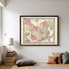 The image is a framed vintage map of China, depicting the country in a detailed and intricate manner.